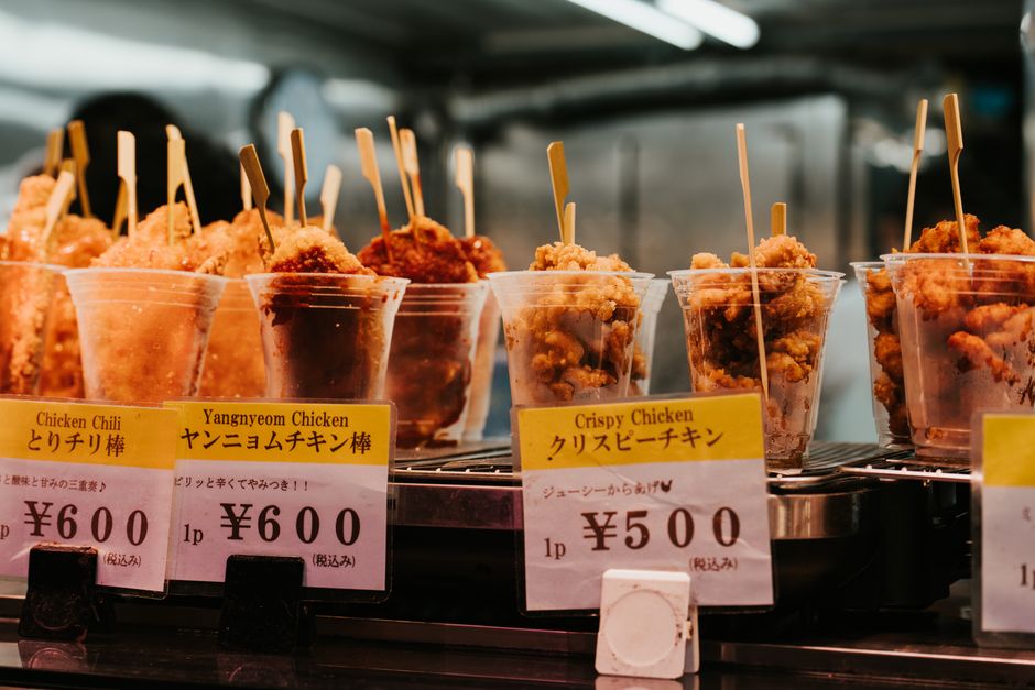 Delicious variety of fried chicken skewers at a Japanese street food vendor. Perfect culinary adventure.